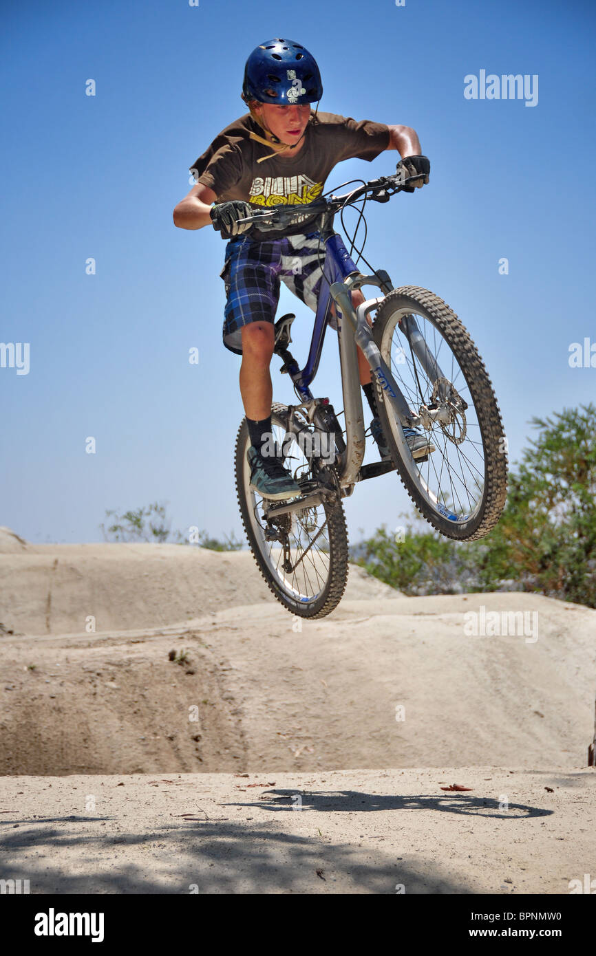 riding bmx and mountain bikes at the Oakley dirt jump track Stock Photo Alamy