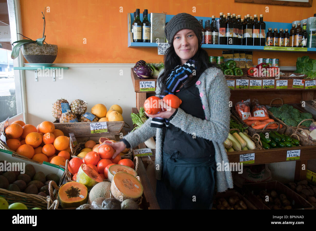 Shop assistant in an organic grocer's shop in Geelong in Australia Stock Photo