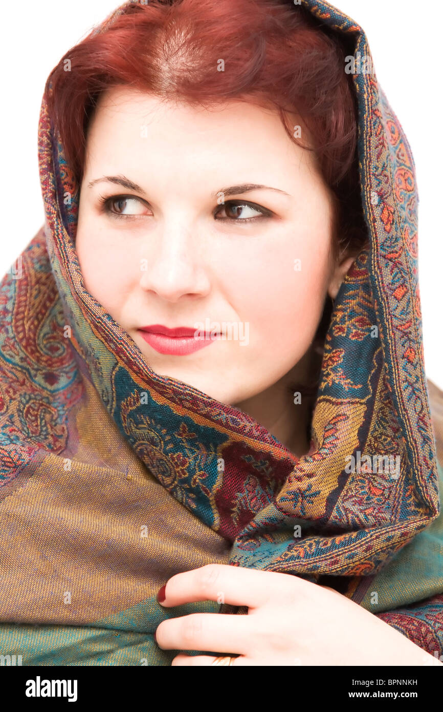 Young woman wrapped with an oriental scarf. Stock Photo