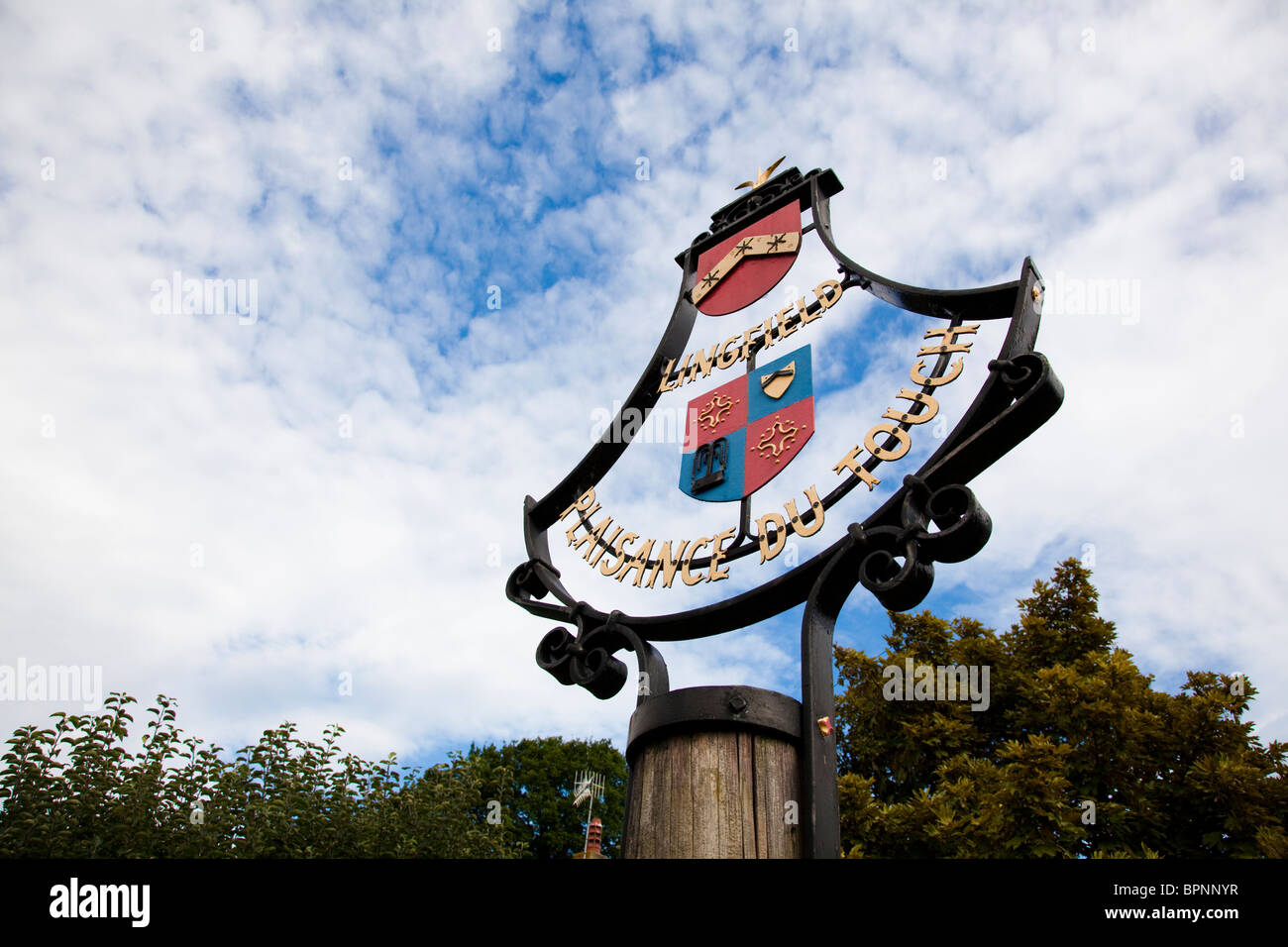 Village sign, Lingfield, Surrey, UK. Twinned with Plaisance du Touch