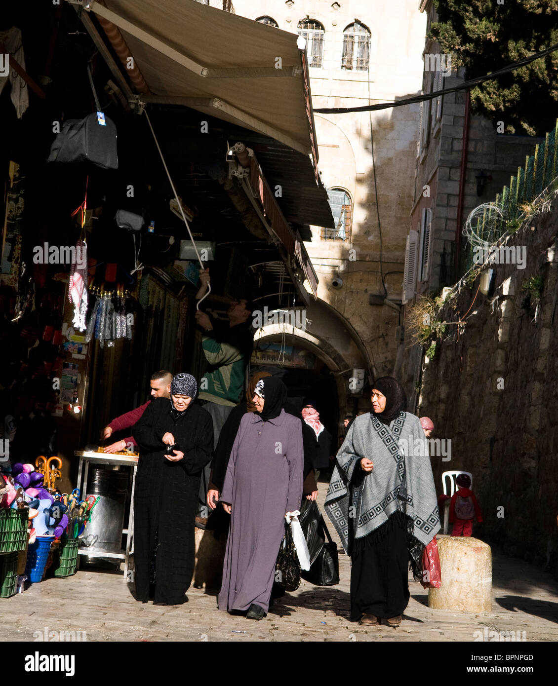 Palestinian women walking in the streets of the old city of Jerusalem. Stock Photo