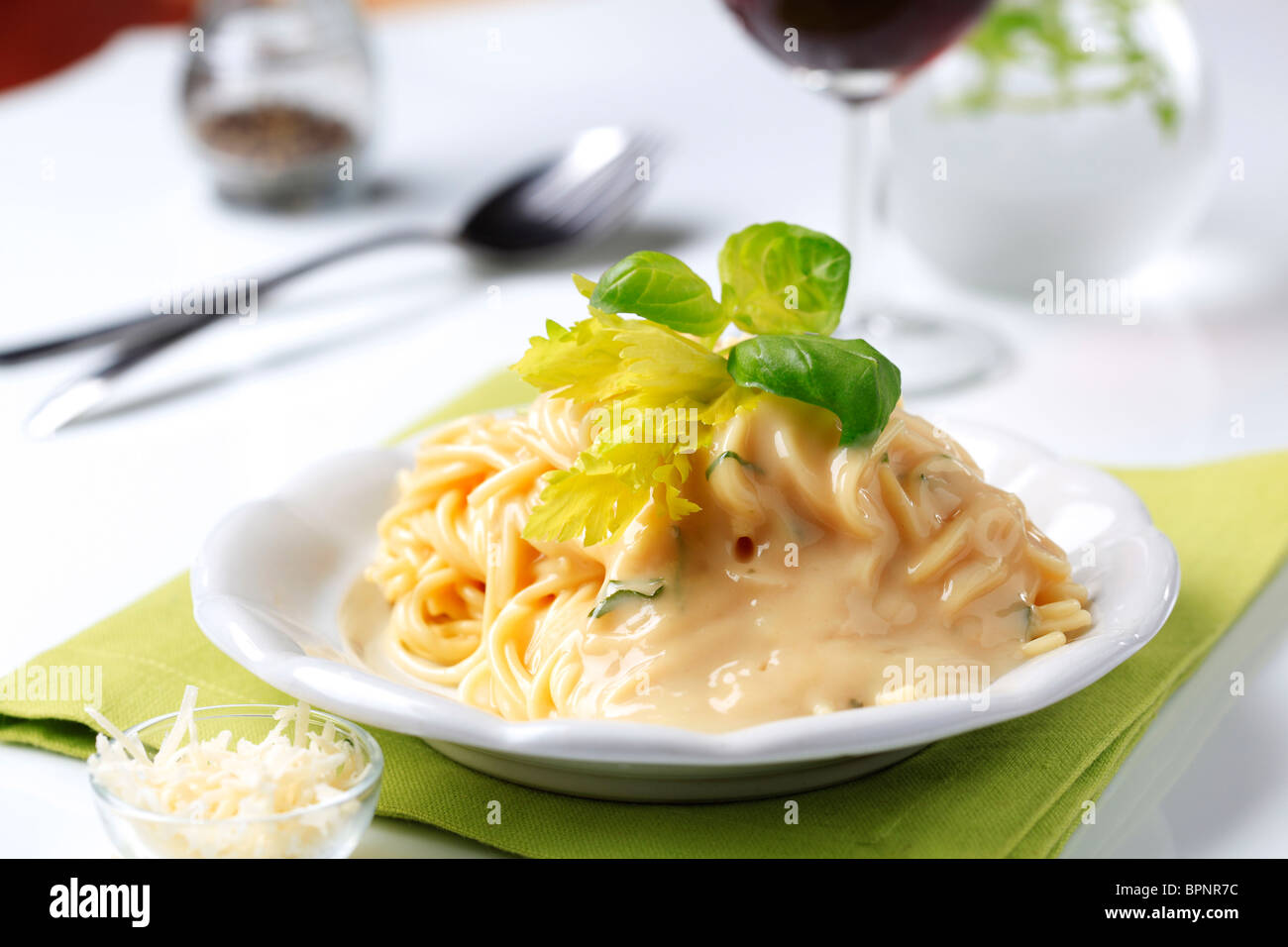 Portion of spaghetti with cheese sauce Stock Photo