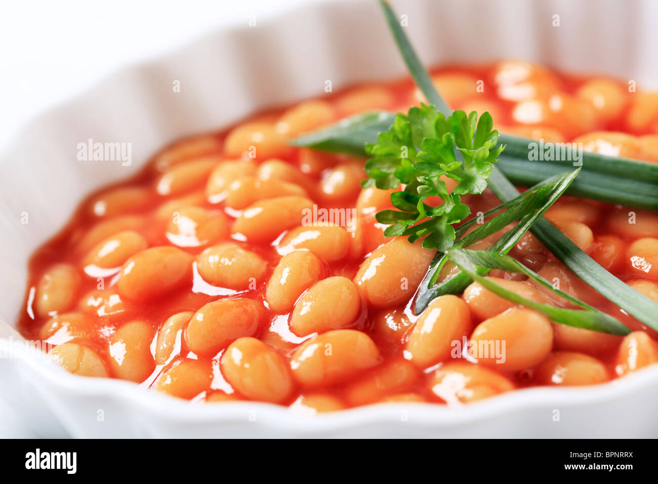 Baked beans in a porcelain casserole dish Stock Photo