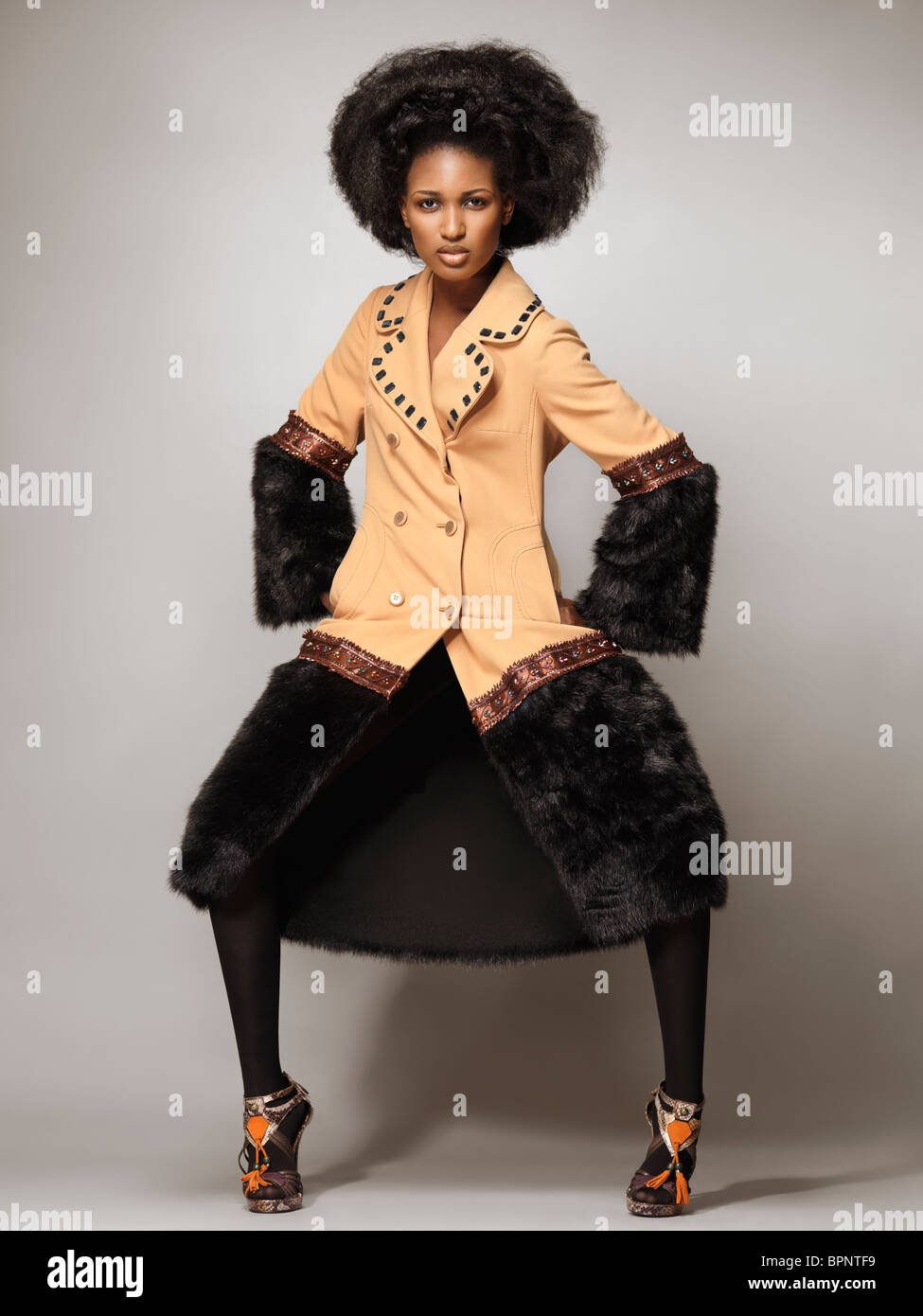 License available at MaximImages.com High fashion photo of a young woman wearing a coat with black fur Stock Photo