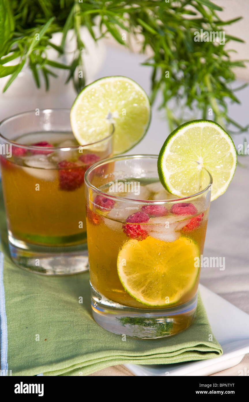 Iced Raspberry Lime Ice tea with raspberry and lime Stock Photo - Alamy