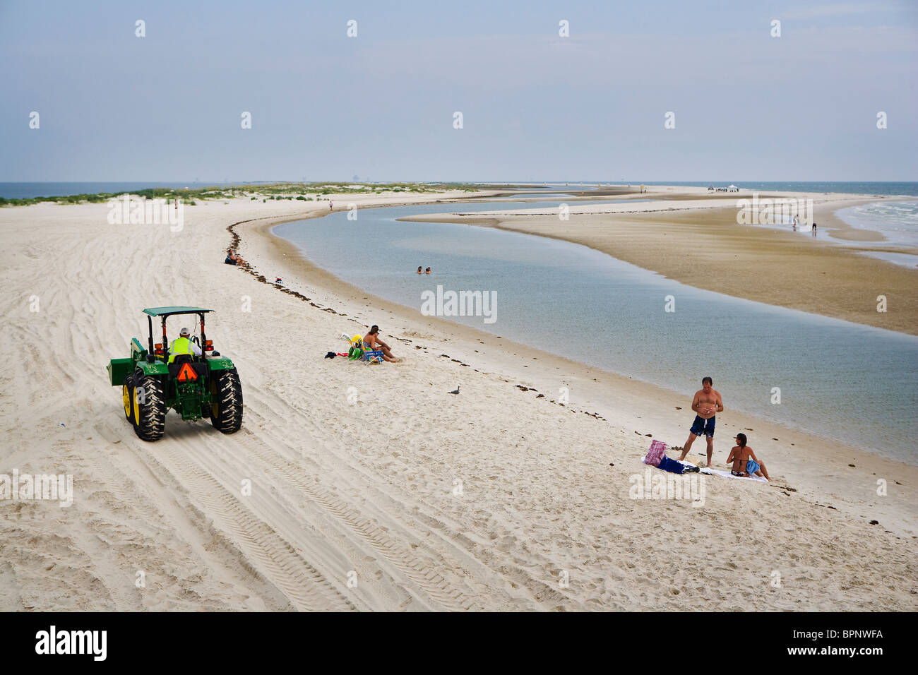 Clean but almost empty beaches with oil rigs on the horizon on Dauphin