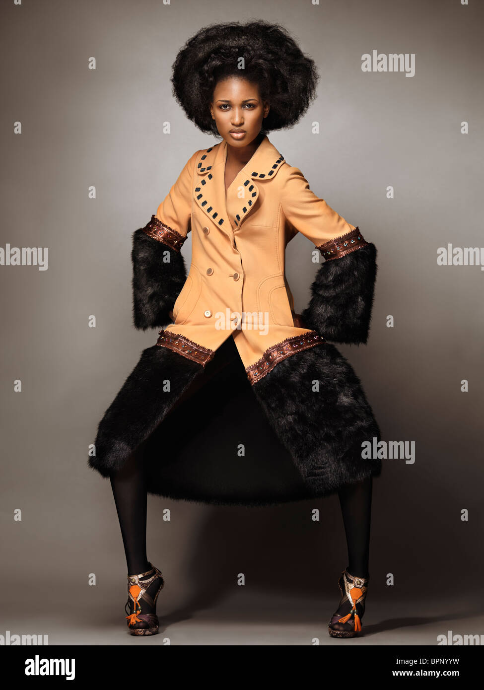 Woman wearing beige coat hi-res stock photography and images - Alamy