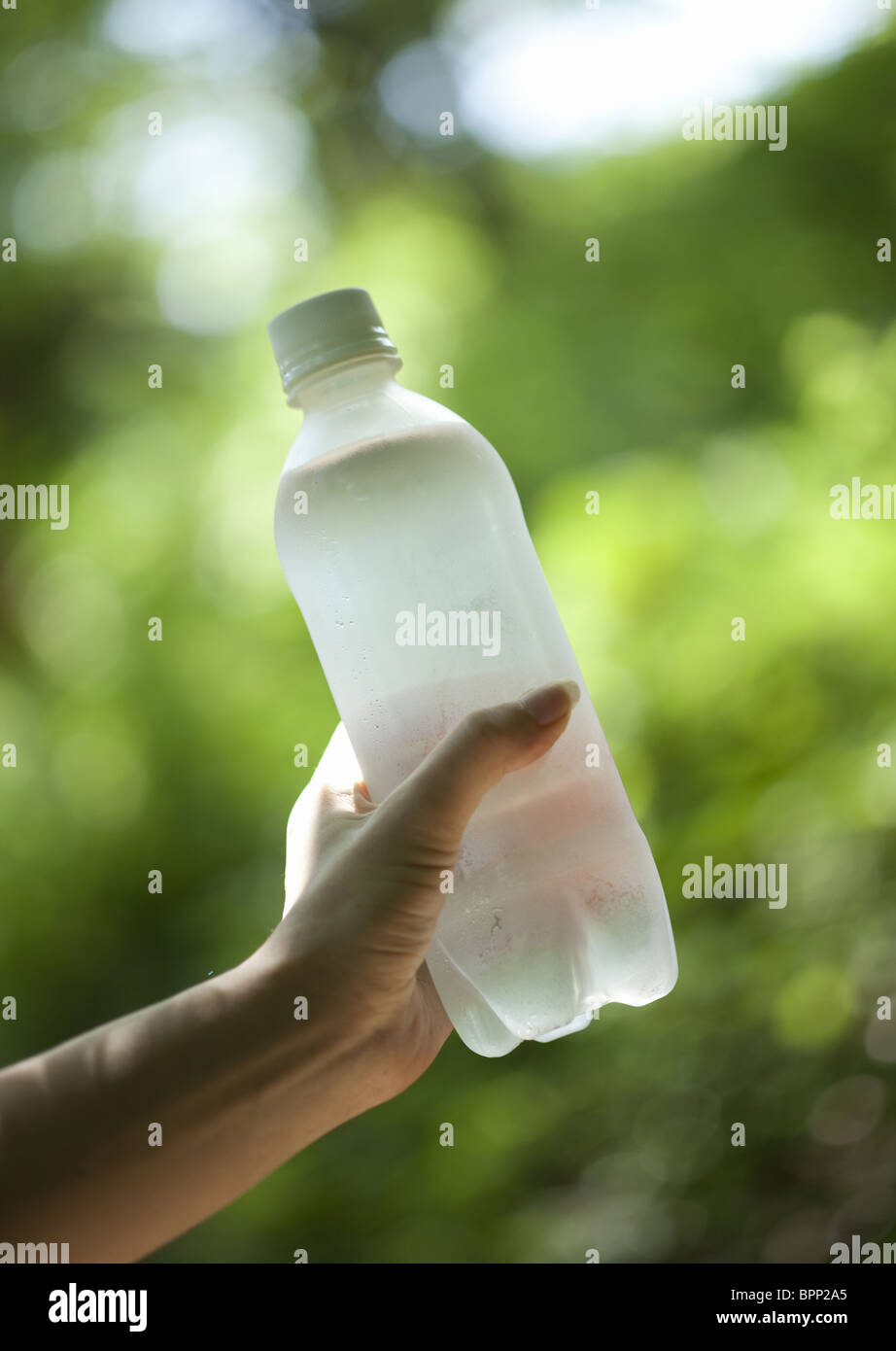 Closeup of hand holding plastic bottle Stock Photo Alamy