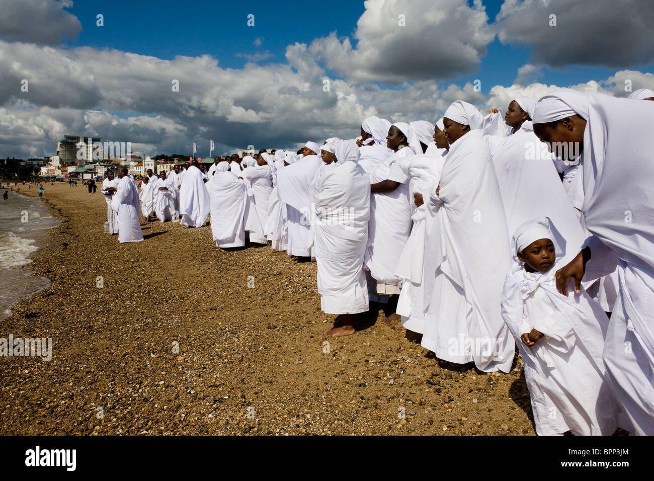 Members of the Apostles of Muchinjikwa Church gathered on Jubilee Beach in Southend.  Photo by Gordon Scammell Stock Photo