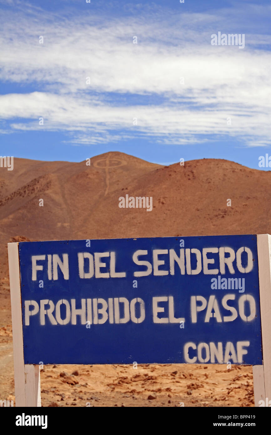 Pintados geoglyphs, in the Atacama Desert, near Iquique, northern Chile, and CONAF (Corporacion Nacional Forestal de Chile) sign Stock Photo
