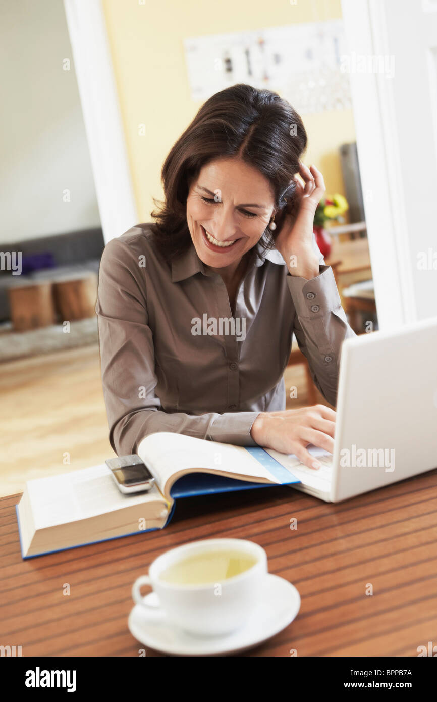 Woman working at home Stock Photo