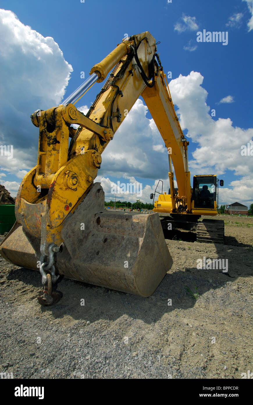 Yellow Front End Loader / Excavator On A Construction Site Stock Photo