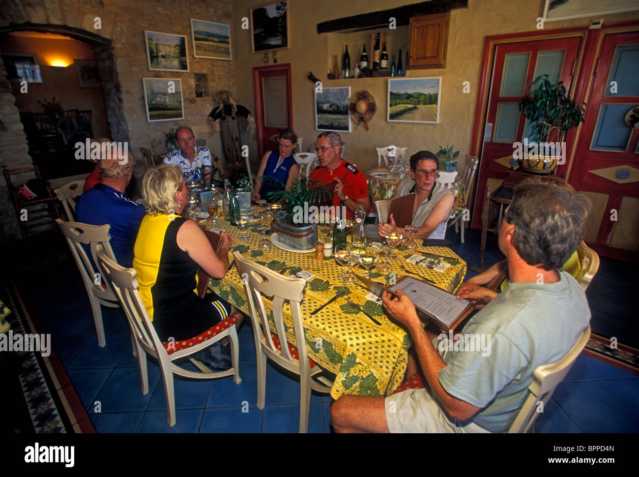 people, tourists, bicyclists, eating lunch, Le Crillon restaurant, French food and drink, French restaurant, village of Murs, Murs, Provence, France, Stock Photo