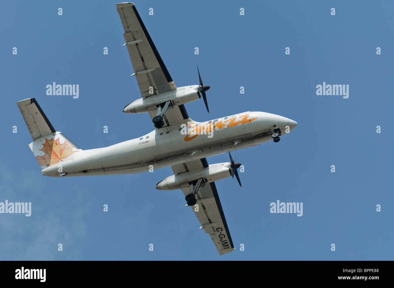 turboprop passenger aircraft landing gear down Stock Photo