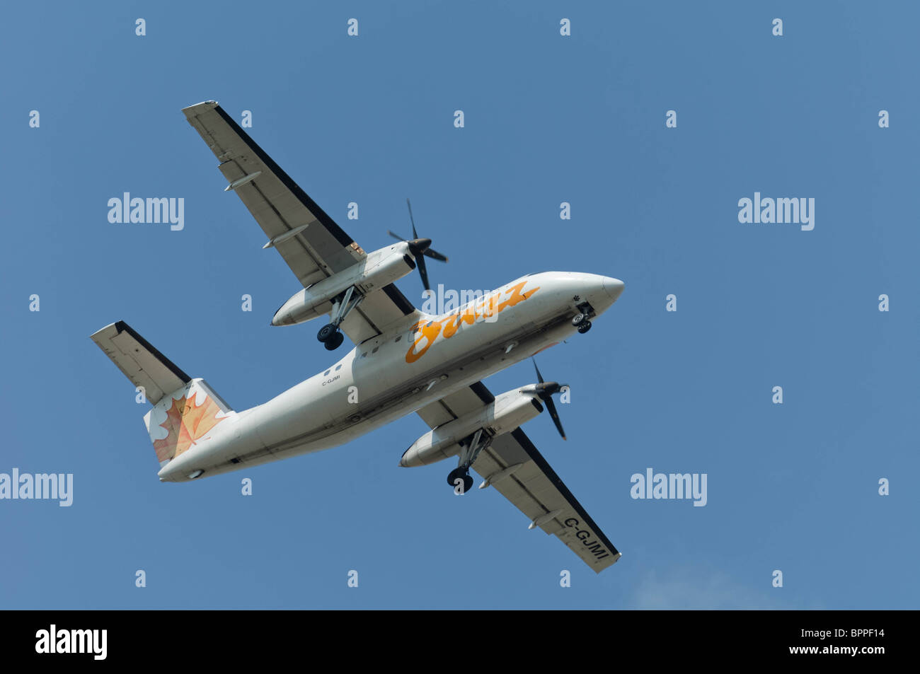 Air Canada Jazz C-GJMI, a DHC-8-102 Dash 8 aircraft on final approach for landing and passenger disembarkment. Stock Photo