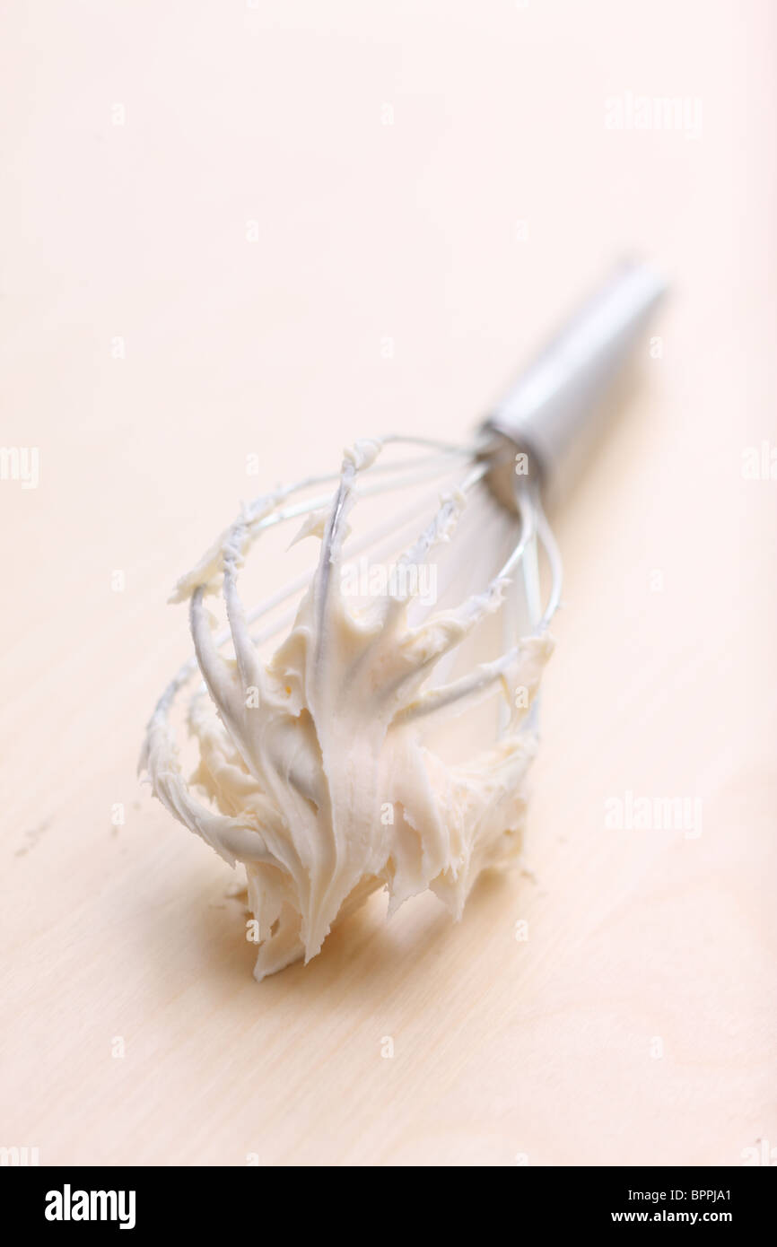 Wire whisk with frosting Stock Photo