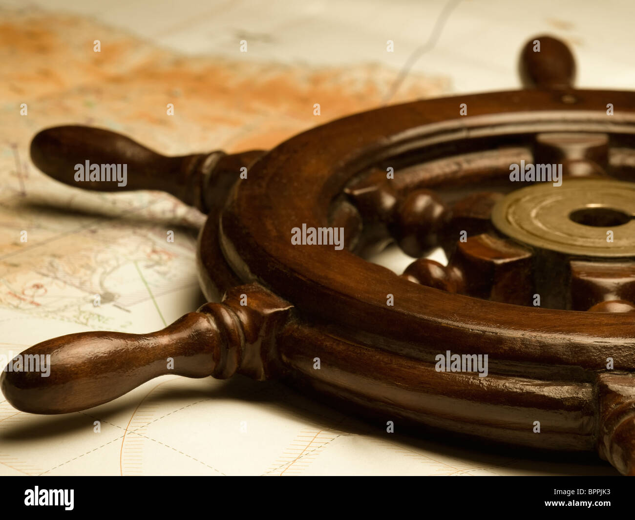 helm and the map,shallow DOF, useful for various navigation or travel themes Stock Photo