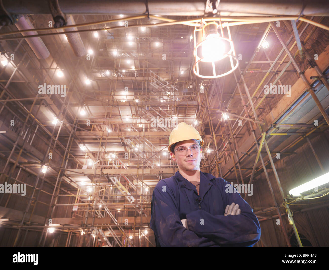 Worker posing inside of a furnace Stock Photo