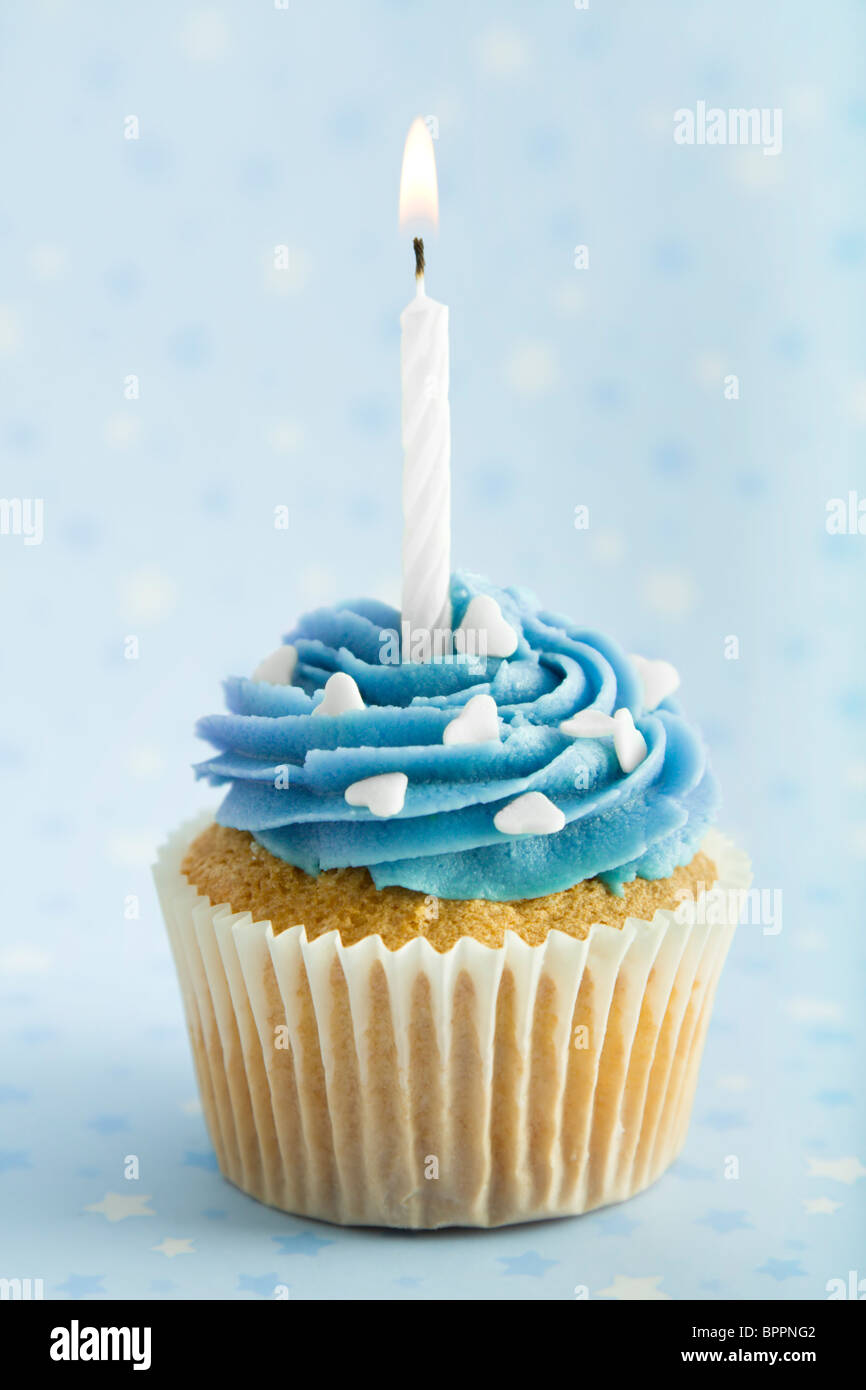 Cupcake With Blue Icing And One Candle High Resolution Stock