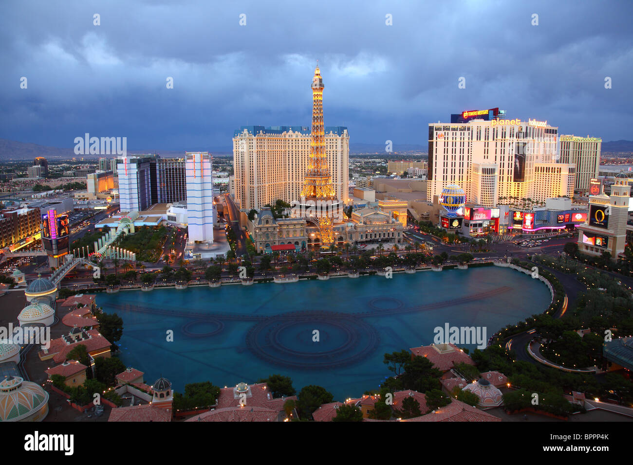 View of the Bellagio fountan and Paris hotel at dusk, Las Vegas Stock Photo