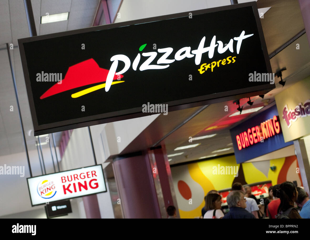 Signs for Pizza Hut and Burger King fast food outlets, Las Vegas airport, Las Vegas Nevada USA Stock Photo