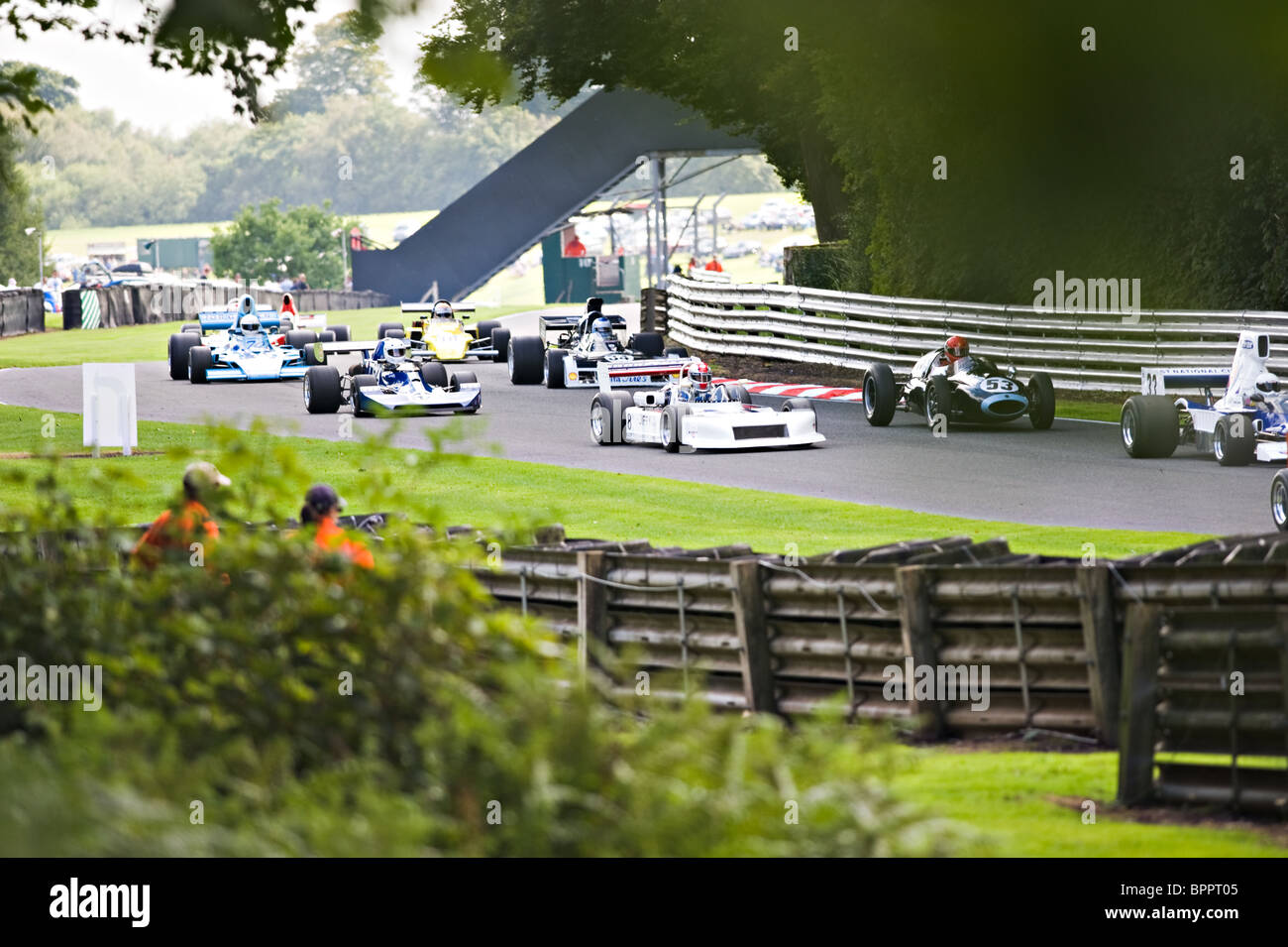Old Racing Cars Approach Druids Corner in Derek Bell Trophy Race at Oulton Park Motor Racing Circuit Cheshire England UK Stock Photo
