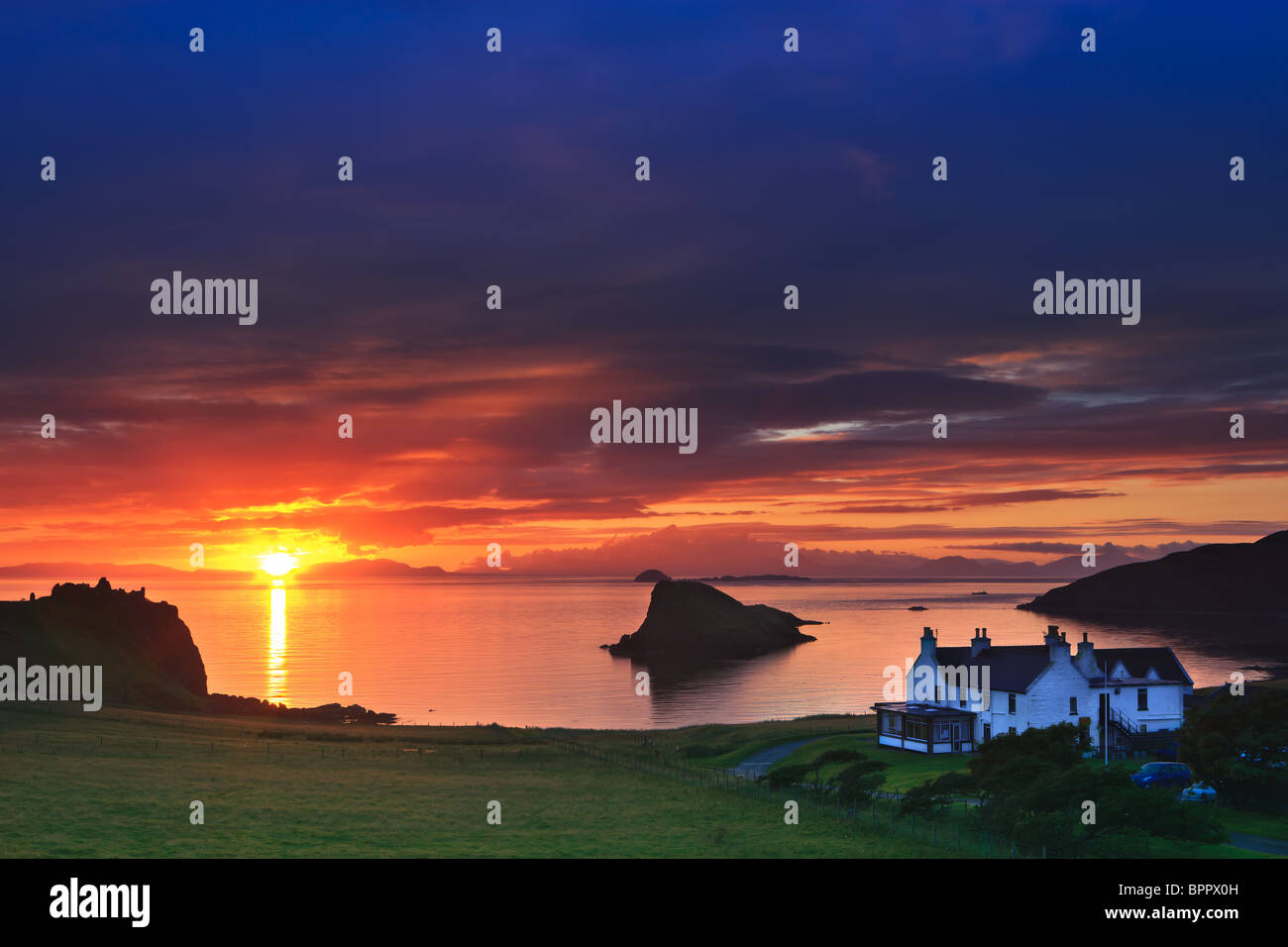 Sunset at Duntulm Castle and Duntulm hotel at the western part of the Isle of Skye in Scotland Stock Photo