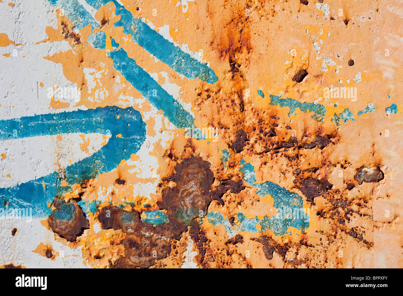 Abstract picture formed by rust and graffiti on sheet of metal Stock Photo