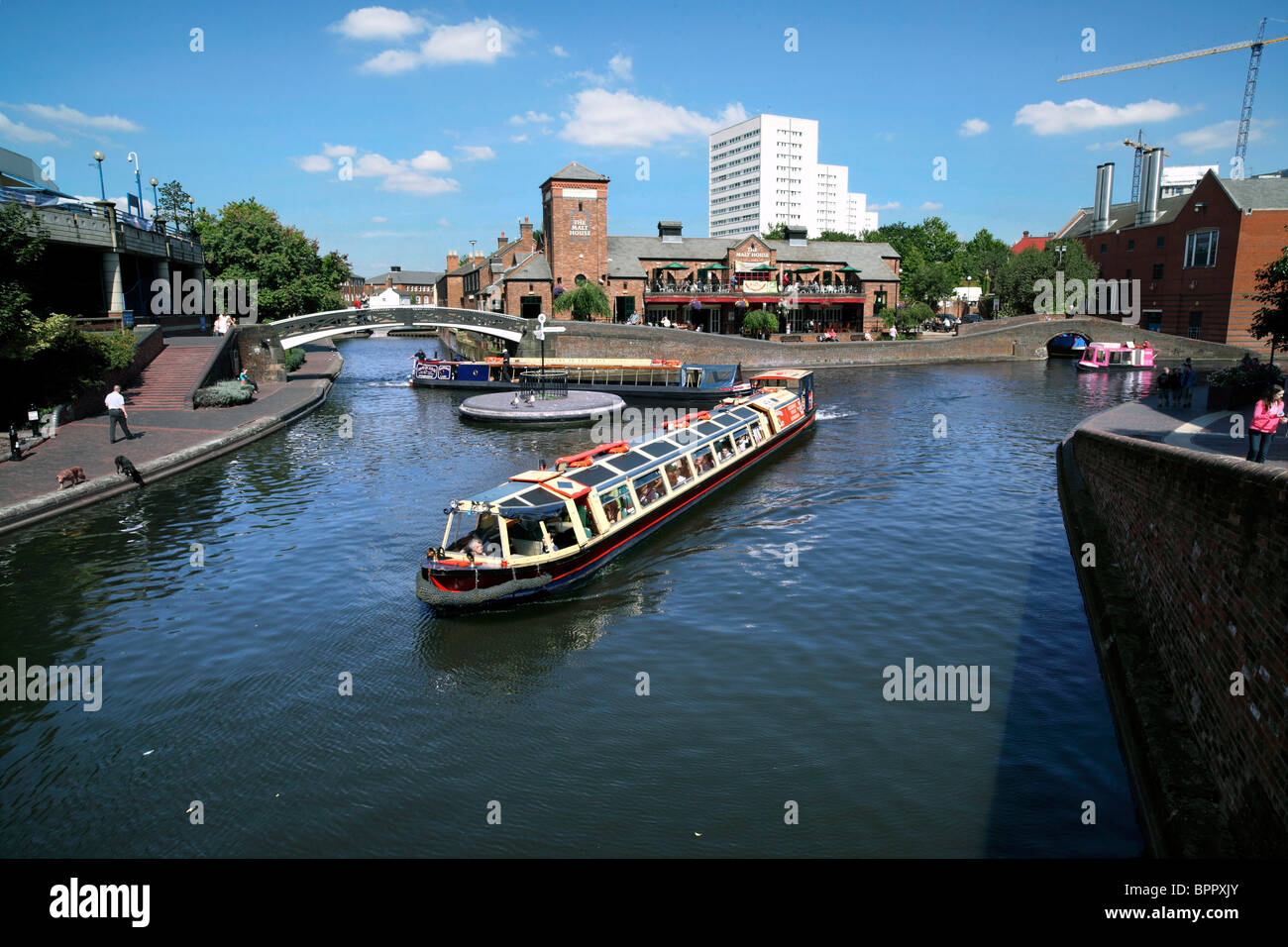 A tourist barge passes Old Turn Junction on the Birmingham canal network Stock Photo
