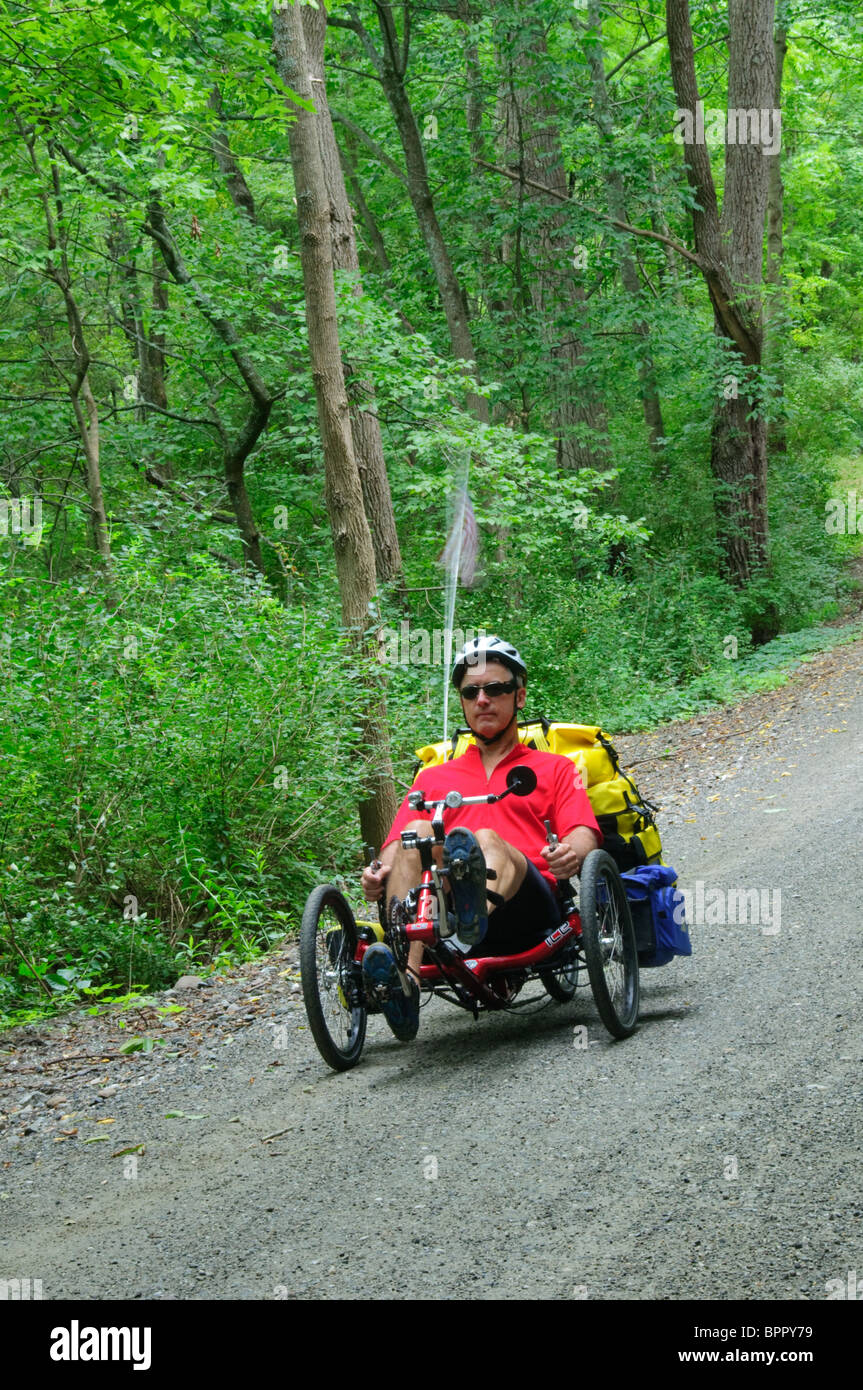 A man riding a recumbent tricycle on a country road Stock Photo Alamy