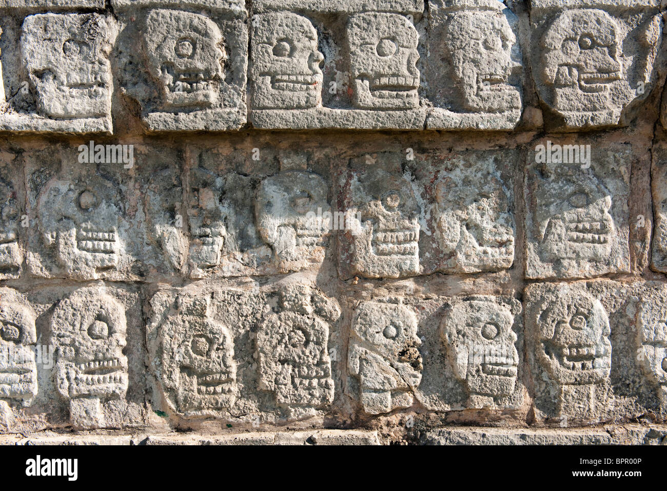 Tzompantli, carving of skulls on a platform for human sacrifice, Chichen Itza ruins, The Yucatan, Mexico Stock Photo