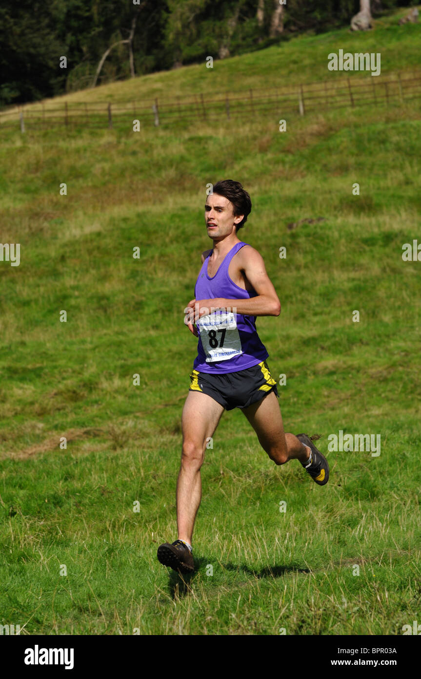 Fellrunner competing at Grasmere Sports in the senior guides race Stock