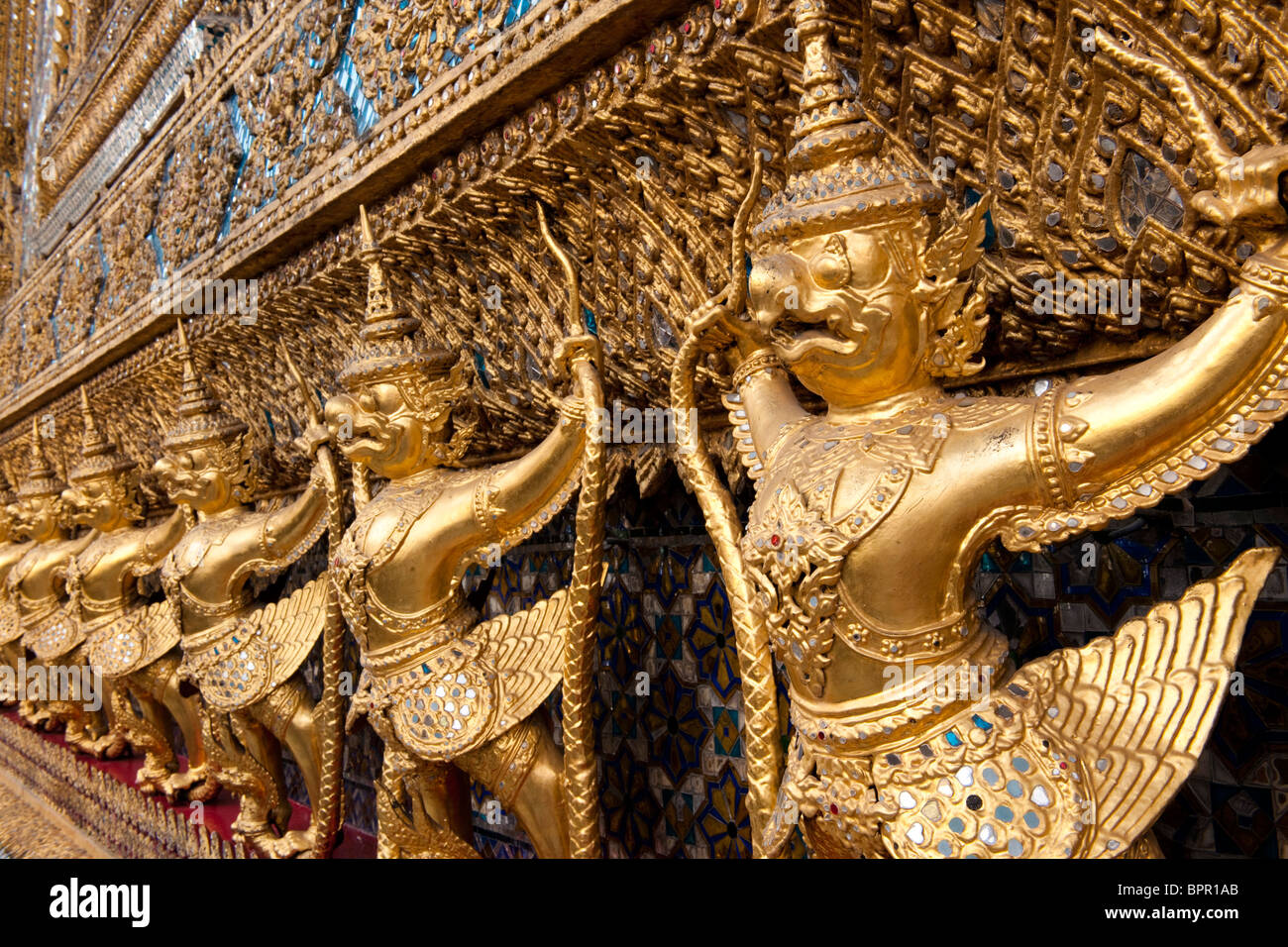 gold Kinnara statues, Temple of the emerald Buddha, Wat Phra Kaeo, Grand Palace, Bangkok, Thailand Stock Photo