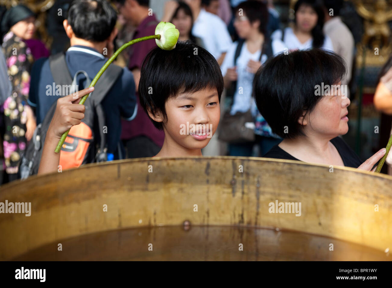 People worshipping, Wat Phra Kaeo, Grand Palace, Bangkok, Thailand Stock Photo
