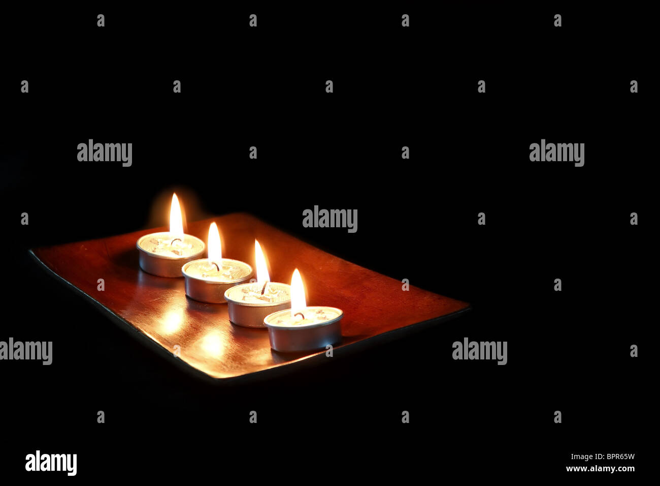 Burning Candles isolated on black background Stock Photo Alamy