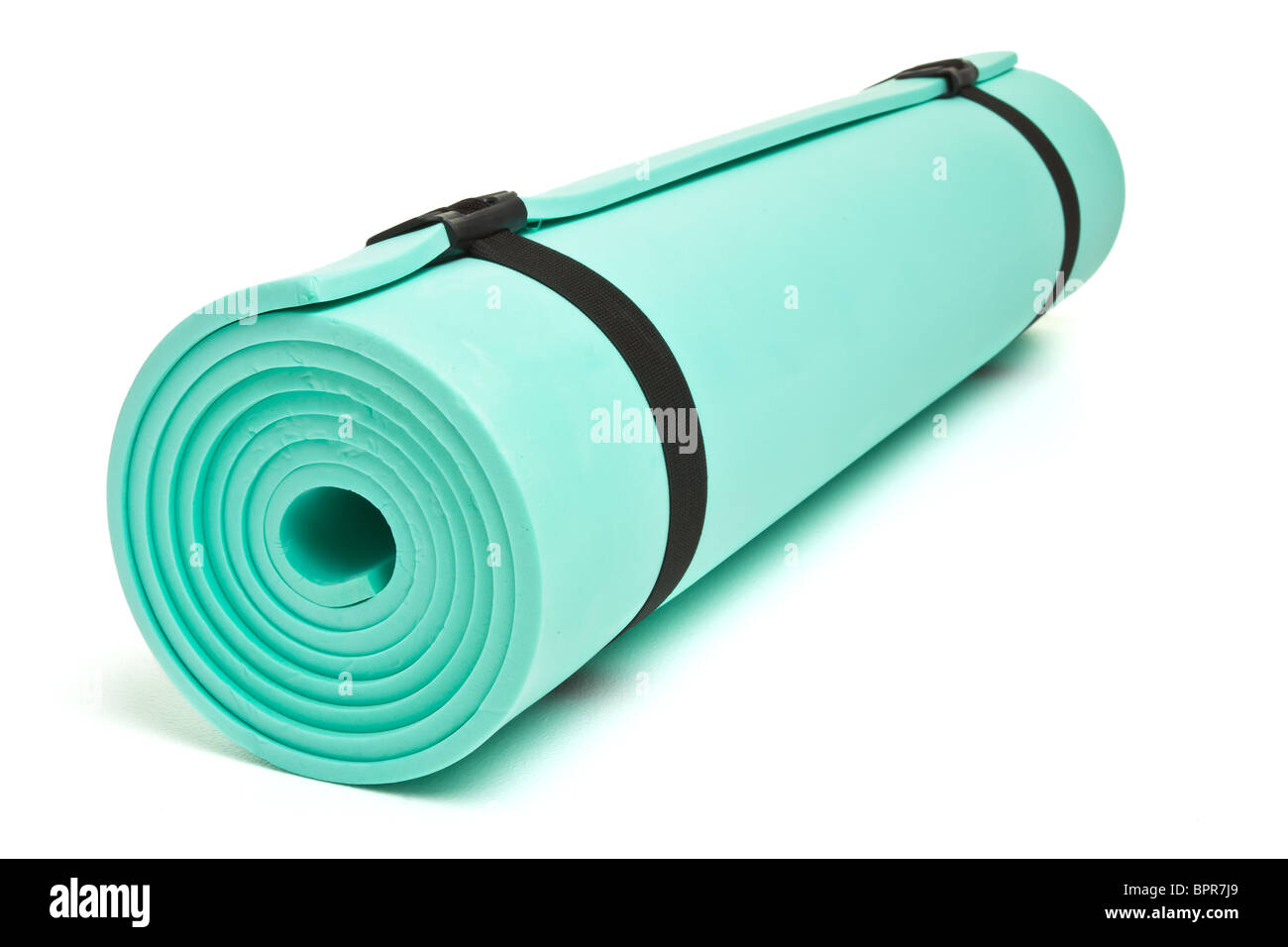 Lightweight foam Camping Bed roll or Yoga mat isolated on white. Stock Photo