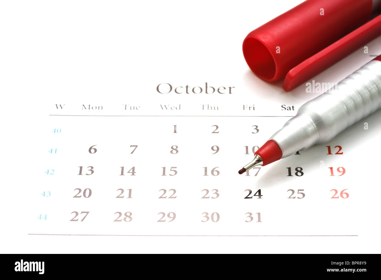 Red pen on a calendar of October. Stock Photo