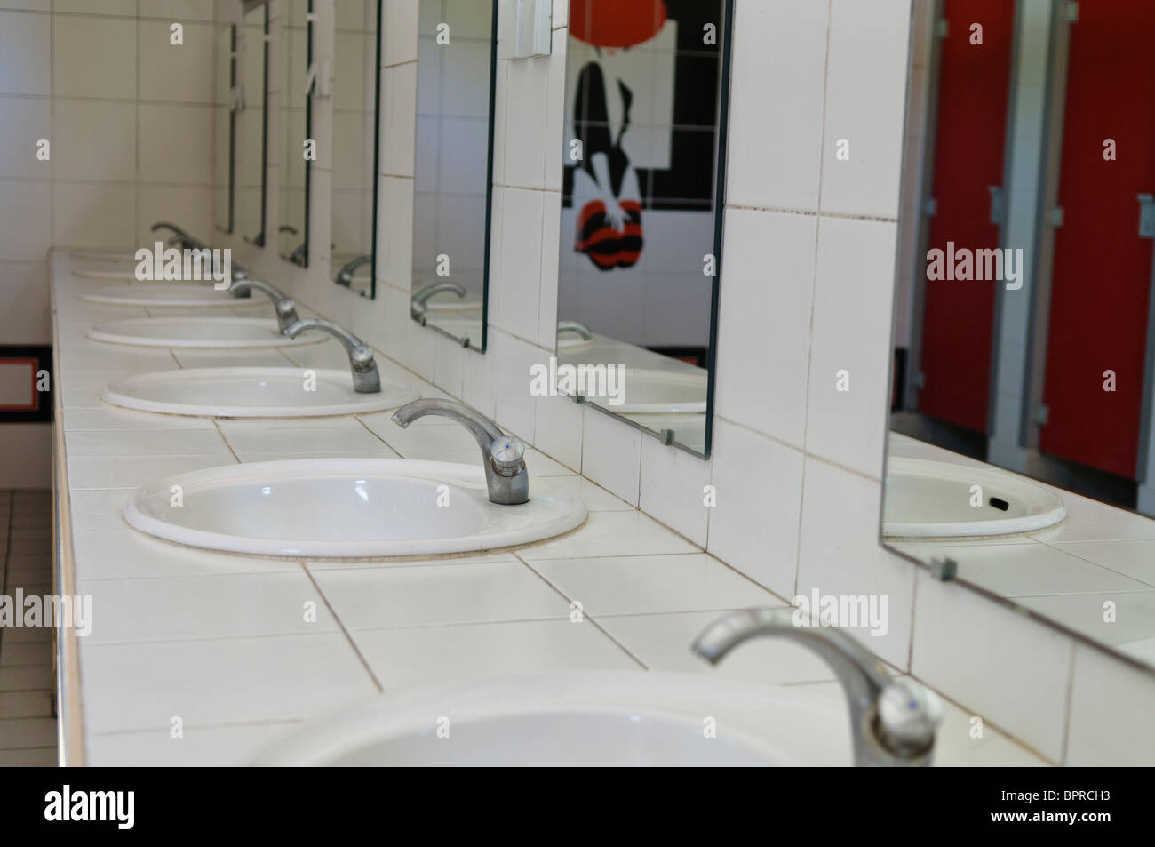 Sinks in a French gents toilet block. Stock Photo