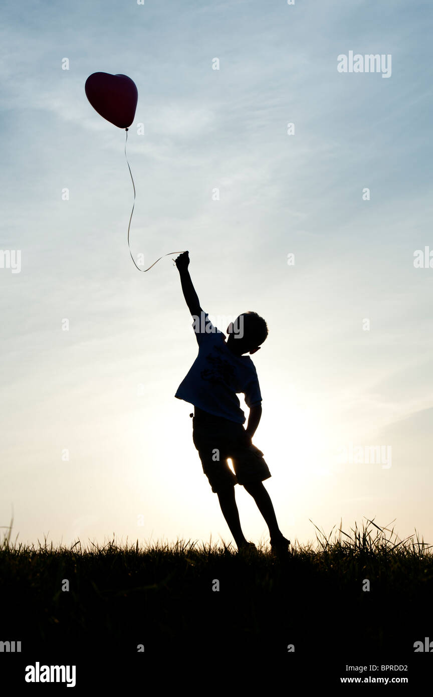 Boy balloon silhouette hi-res stock photography and images - Alamy