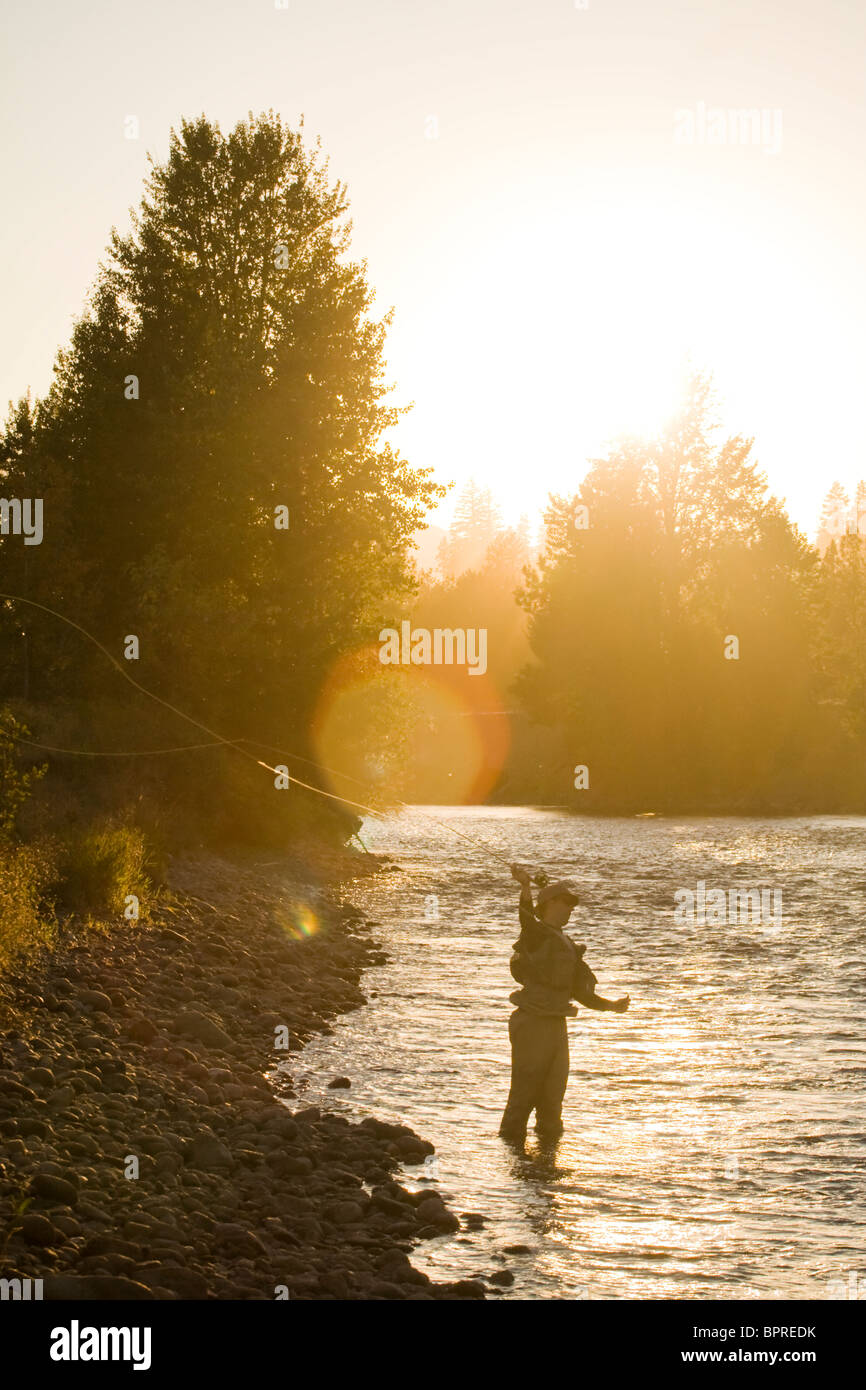 A fly fisherman casts into the Yakima River in Central Washington. Stock Photo