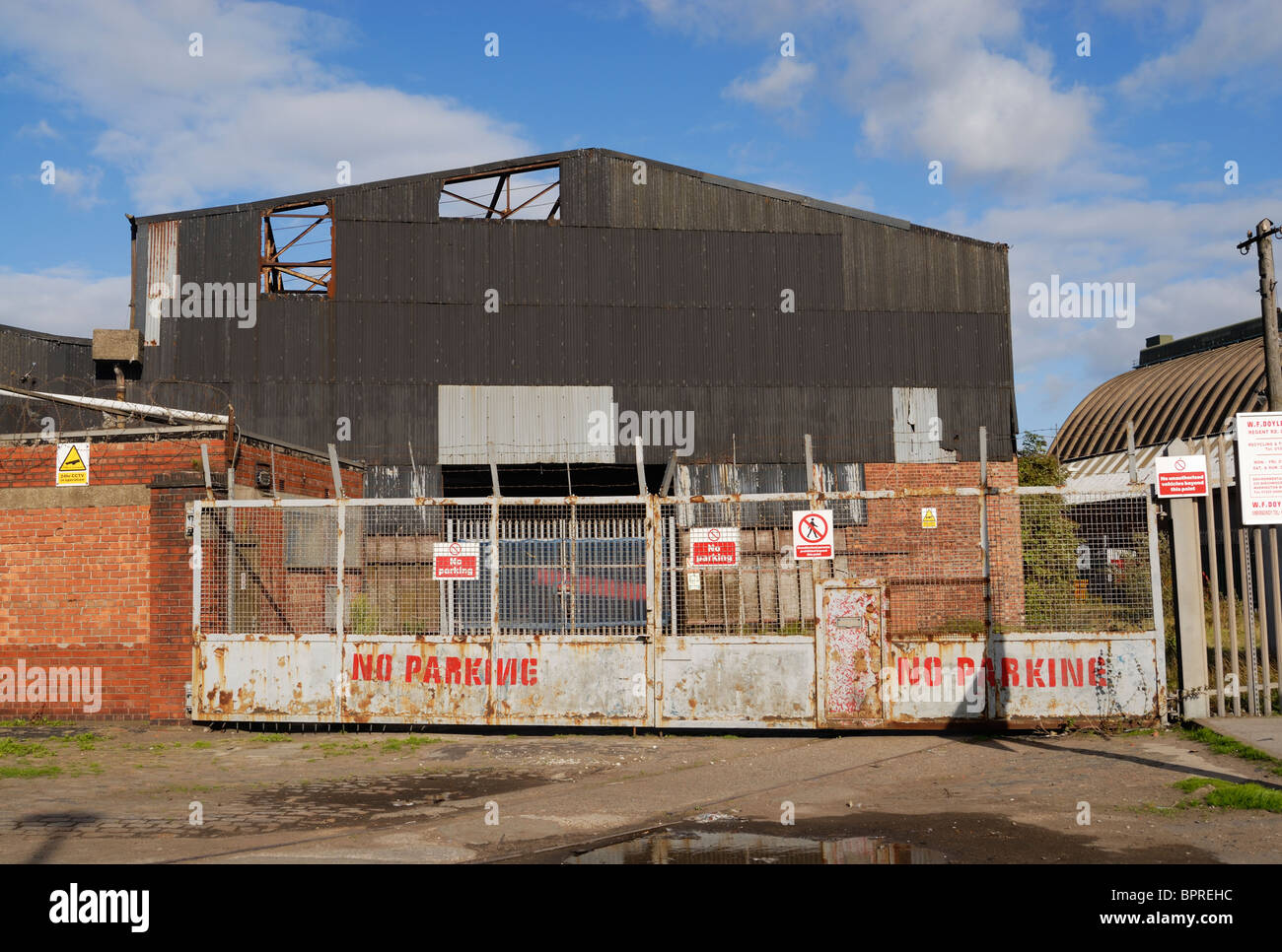 Semi derelict corrugated iron warehouse on Regent Road ( The Dock Road ) by Liverpool Docks in Merseyside. Stock Photo