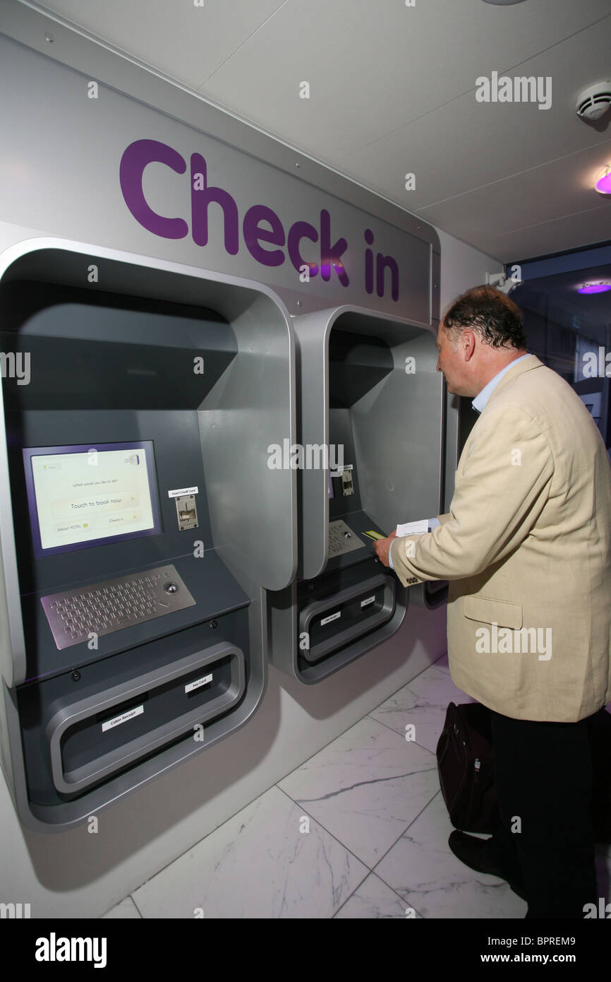 Image shows a man staying at Yotel, a budget hotel made of tiny cabins, Gatwick Airport, England, UK. Photo:Jeff Gilbert Stock Photo