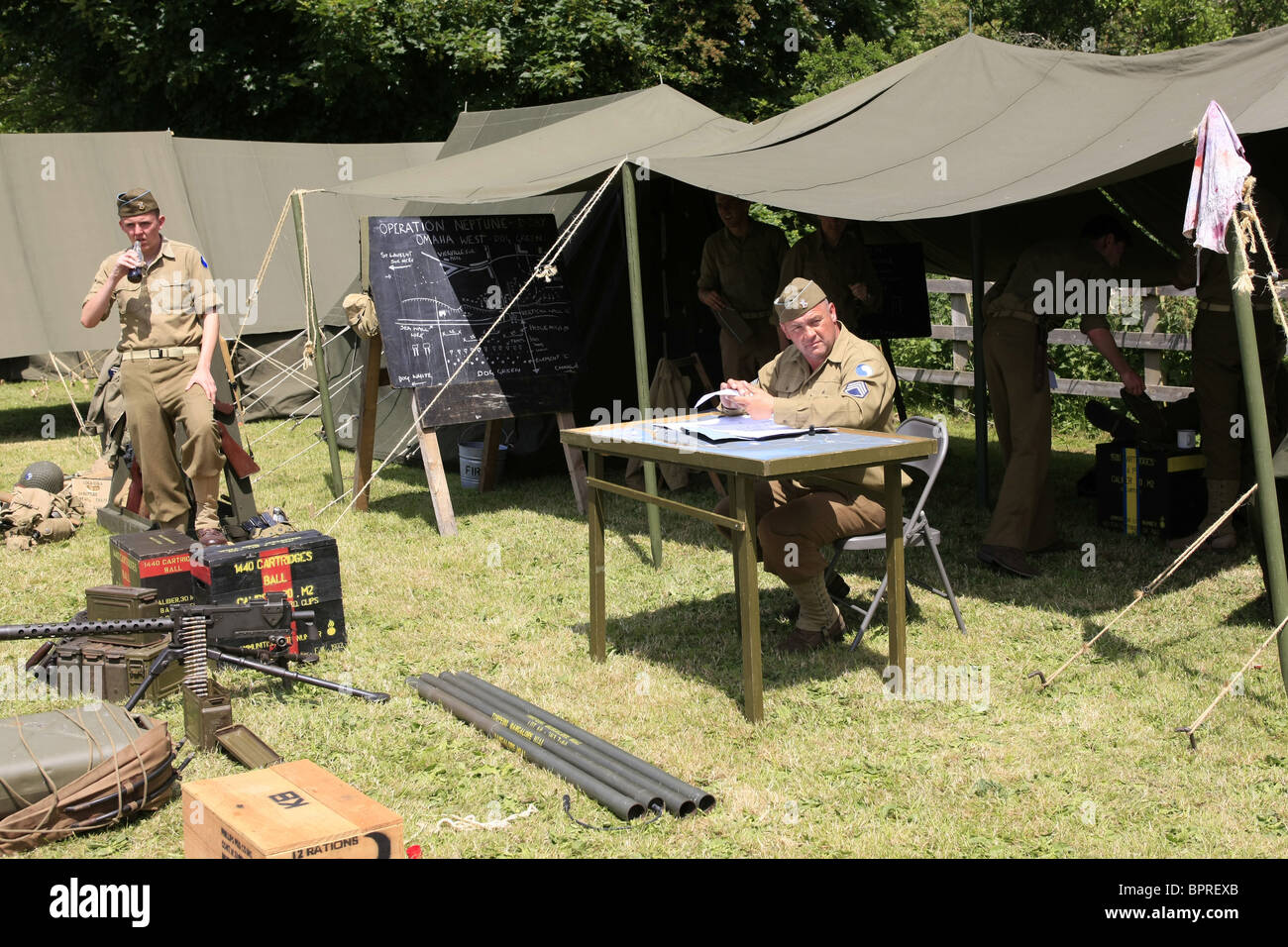 WW2 Reenactment Members wearing the uniforms of men in the 29th Infantry Division on a weekend get together Stock Photo