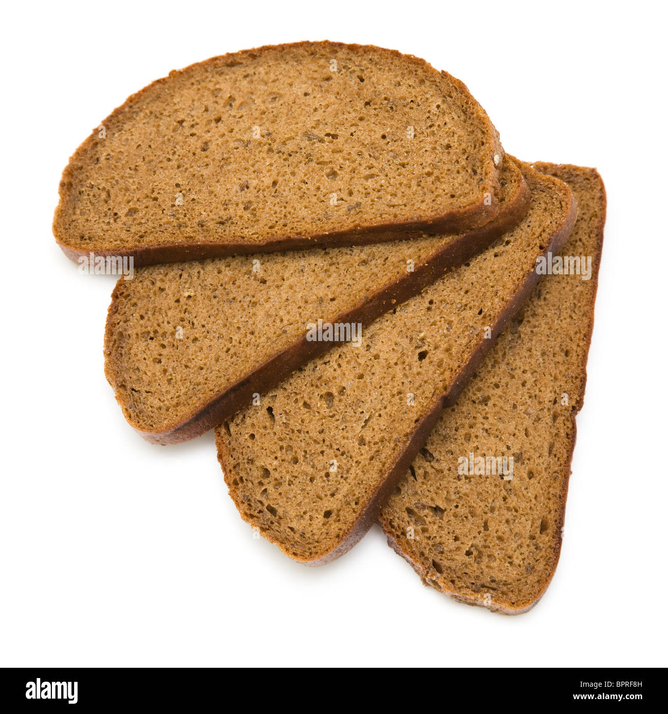 four stacked fanned slices of rye bread with caraway seeds isolated on