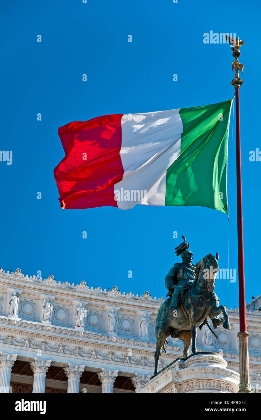 Big italian flag weaving in front of the National Monument of Victor Emmanuel II (Altare della Patria), Rome, Italy Stock Photo