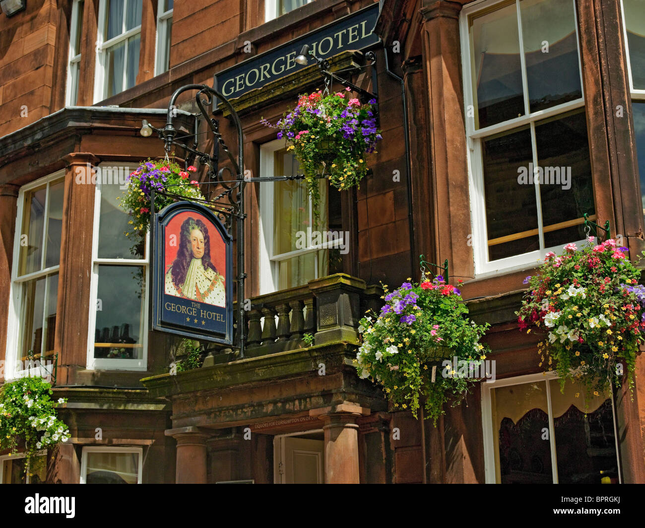 The George Hotel pub sign exterior in summer Penrith Cumbria England UK United Kingdom GB Great Britain Stock Photo