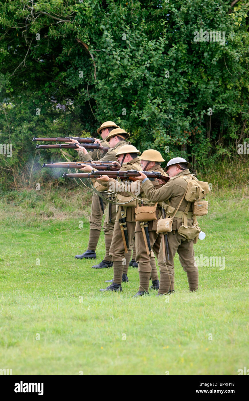 Group of WW1 British re-enactment group demonstrate the use of the Lee Enfield service rifle in a mock firing squad Stock Photo