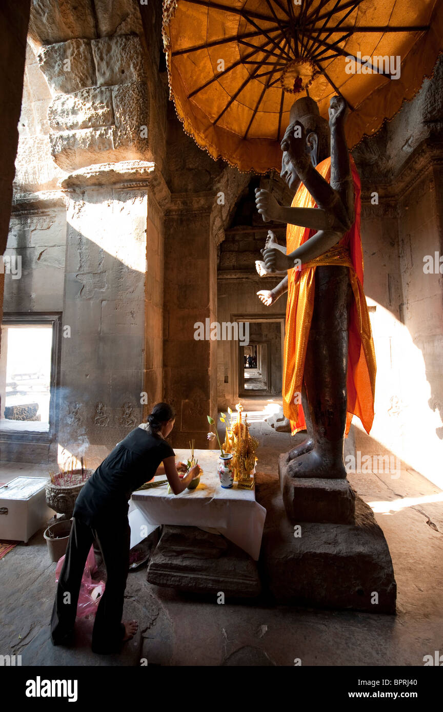 People worshipping buddha, Angkor Wat, Siem Reap, Cambodia Stock Photo