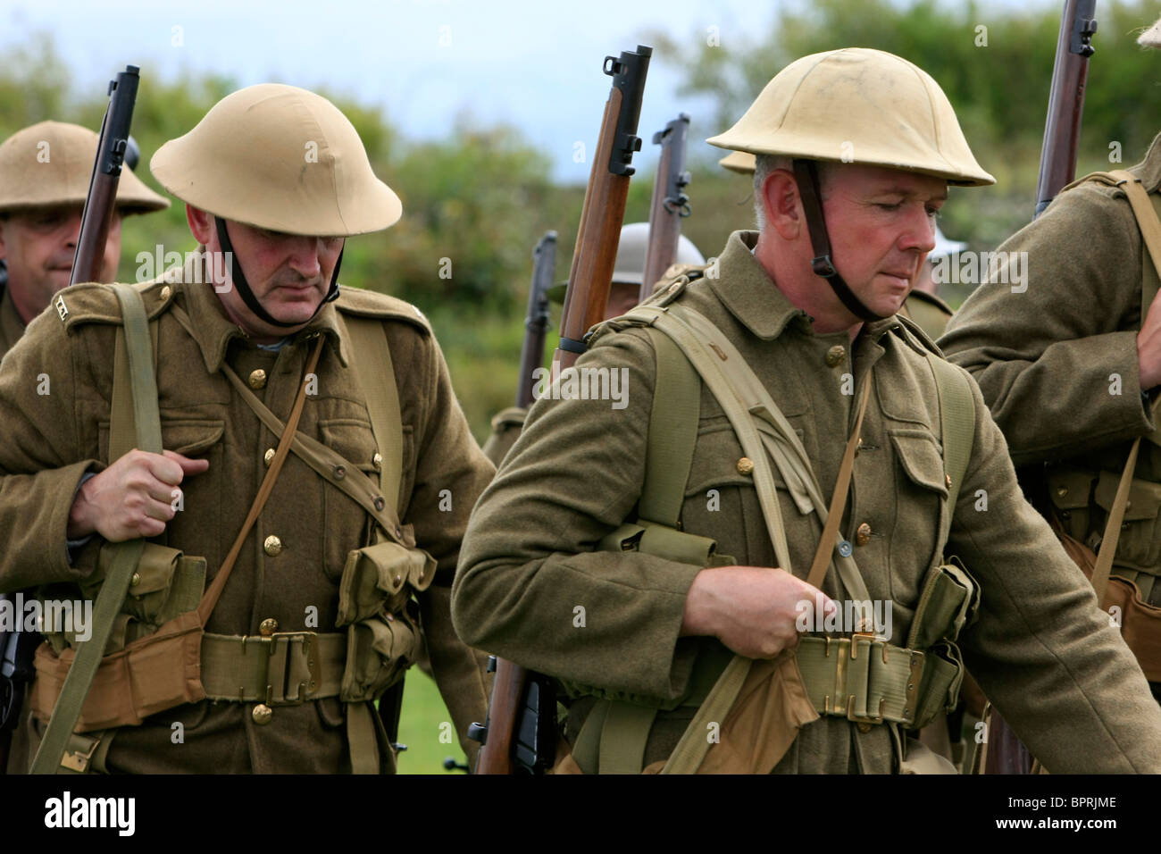 Group of WW1 British reenactment group simulate marching to the front Stock Photo