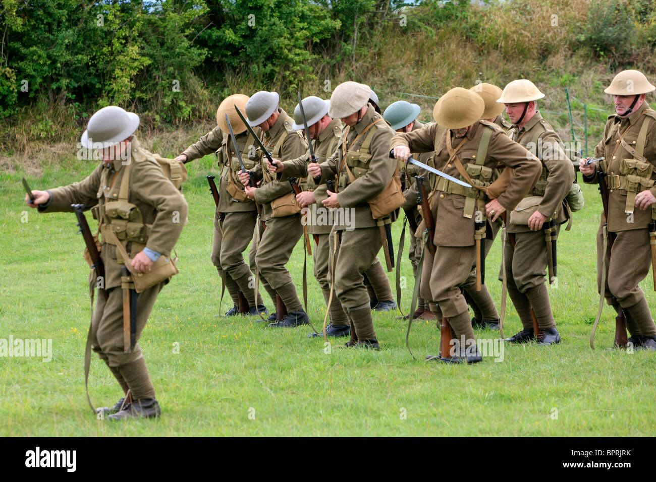 Group of WW1 British re-enactment group demonstrate Army bayonet drill Stock Photo